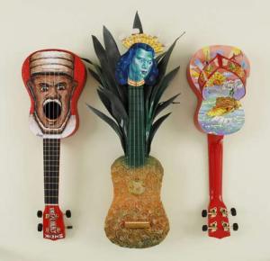 Tiny painted ukulele for Hulu Dreams, by (from left to right) Joel Tarling, Dick Weight and Mark Arbuz. Courtesy of Gallery East